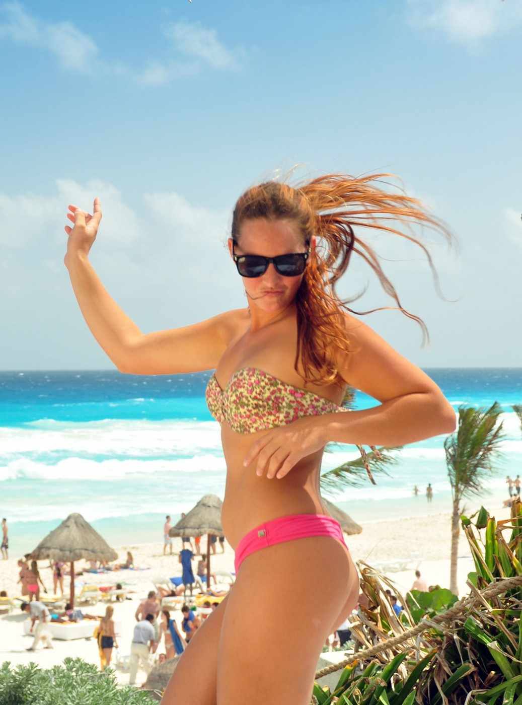 Guests doing activities with entertainers on the beach at Hotel Grand Oasis Cancun