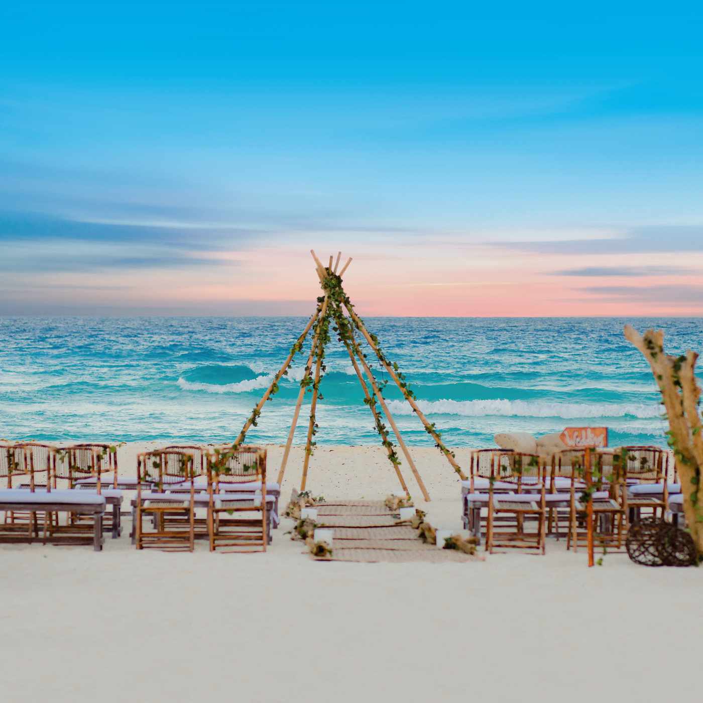 Sea side altar decorated in purple and green at The Pyramid at Grand Oasis Hotel