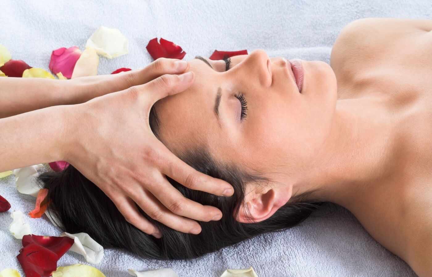 Woman enjoying relaxing massage at Hotel The Pyramid at Grand Oasis