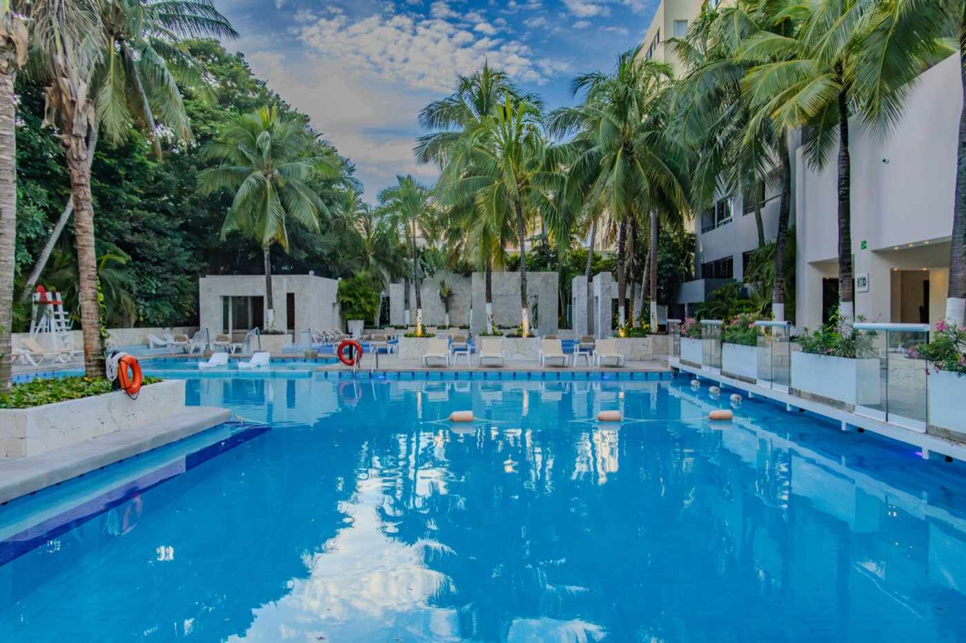 The White Terrace Swimming Pool and Restaurant Area Seen Overnight at Hotel Oh! Cancun The Urban Oas